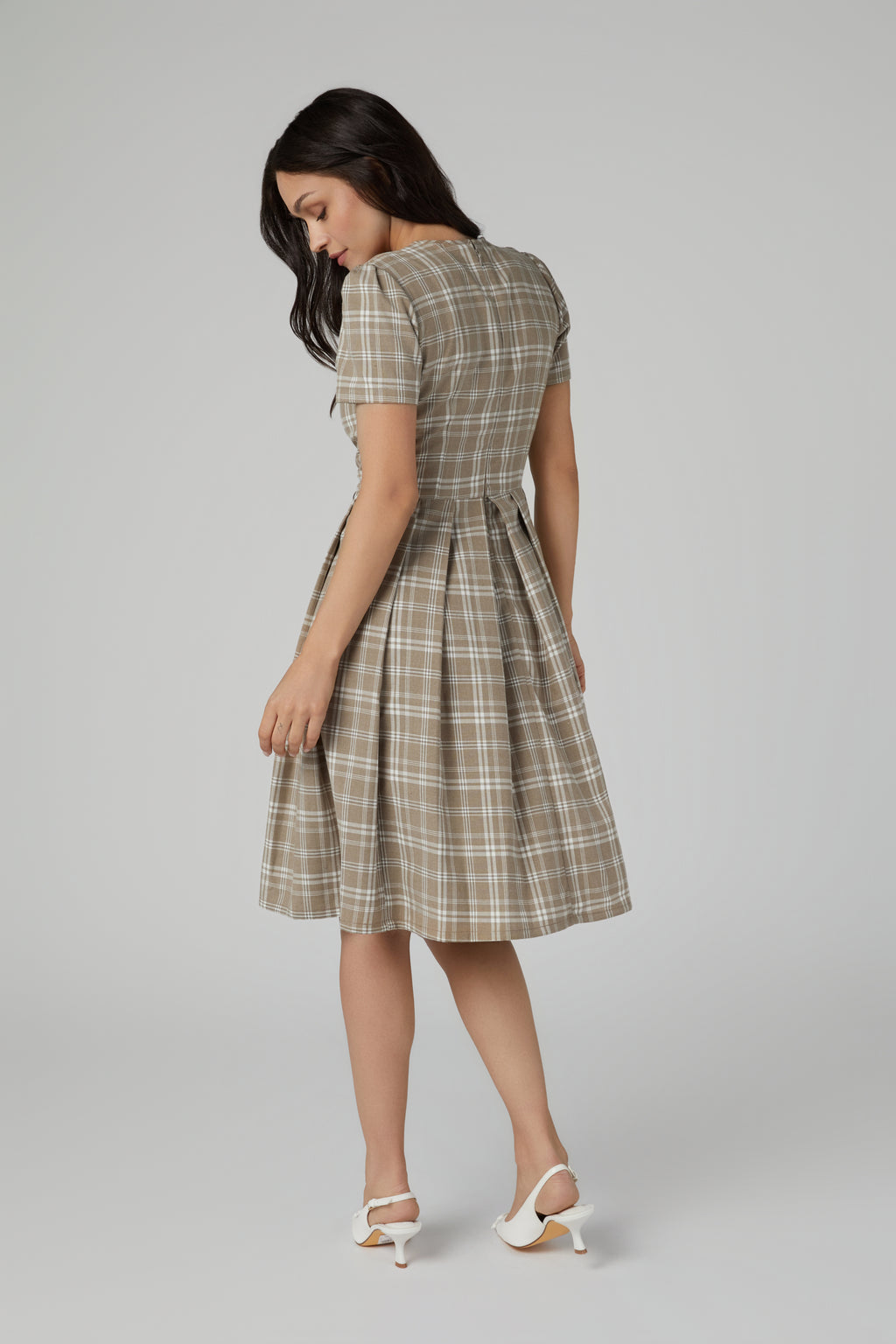 Brown dress with a pleated skirt
