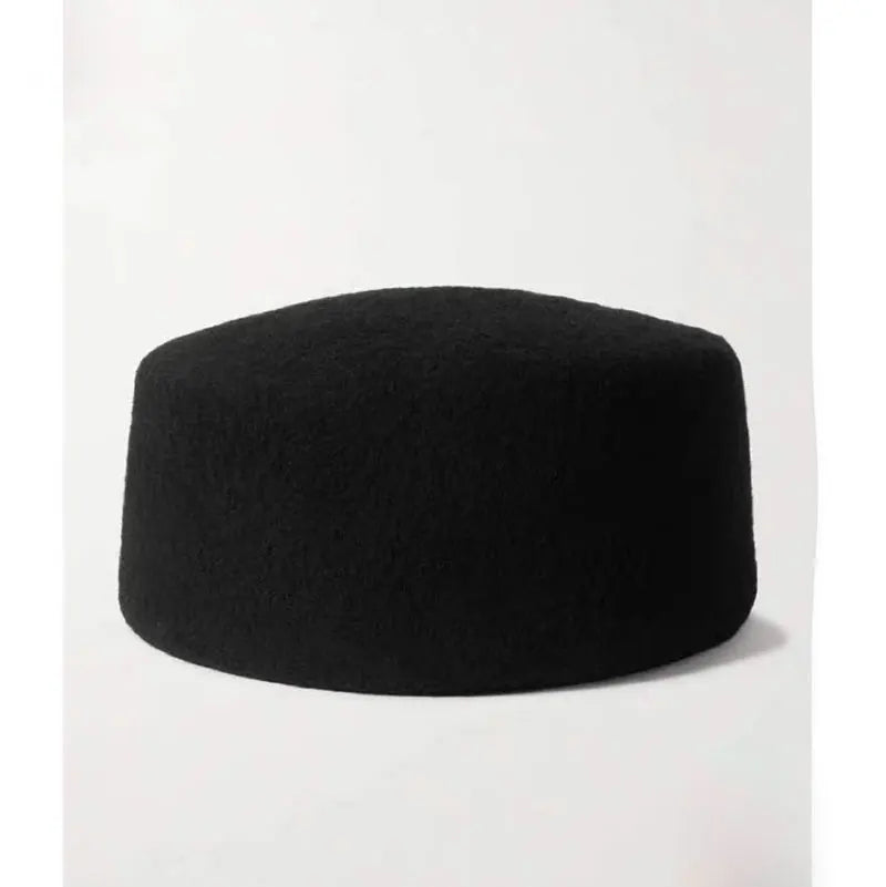 Black fez hat on a white background