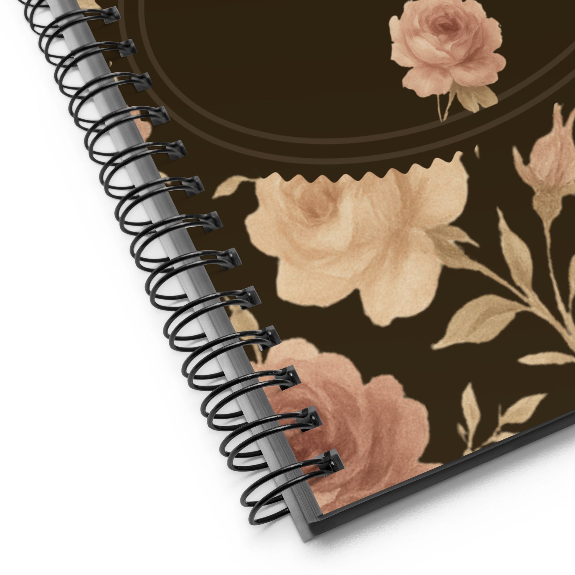 Spiral-bound notebook with floral design on a white background