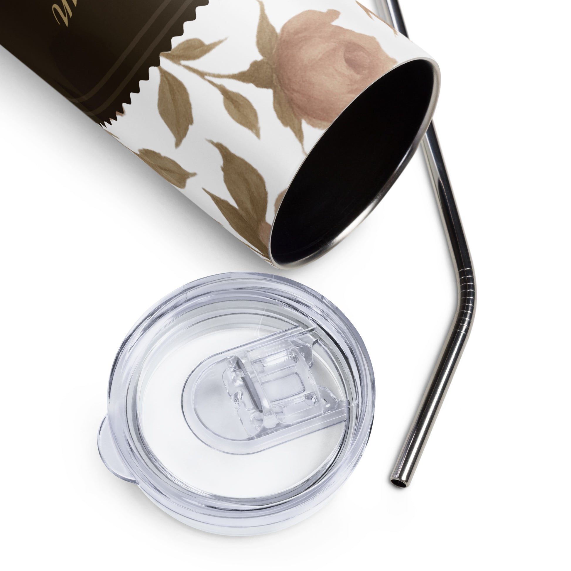 Floral-patterned tumbler with clear lid and metal straw on a white background